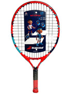 A strung Babolat Ballfighter 19 junior tennis racket with a colorful design, featuring a character and the Babolat logo on the frame, and a small carry bag included.