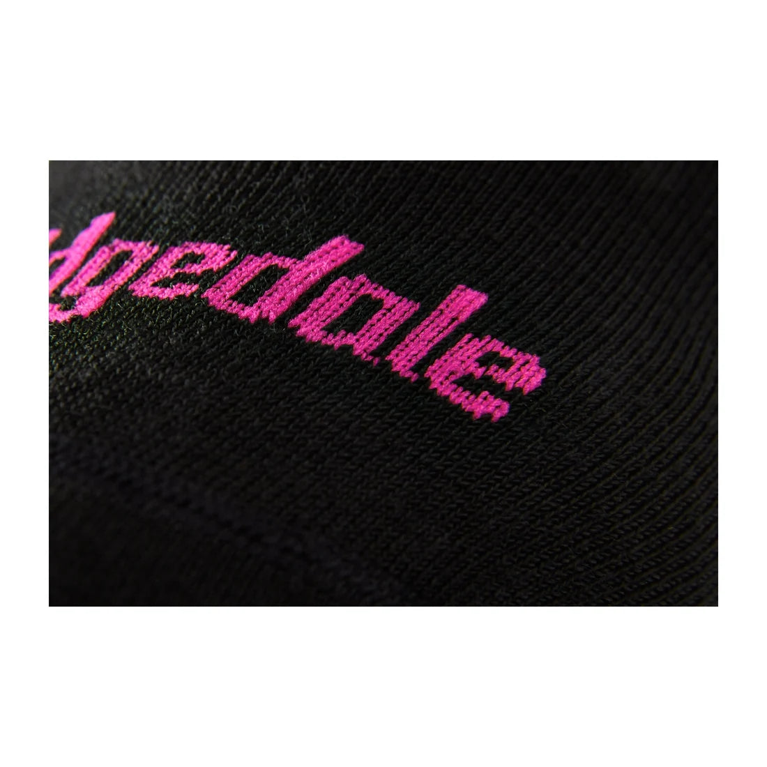Bridgedale Women's Ski Race Performance Over Calf sock in Black/Pink with ultra-thin, low-bulk construction for precise ski boot fit.