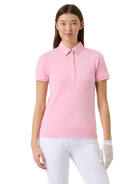 Woman wearing a pink Daily Sports Fairway shortsleeve polo shirt and white pants on a white background