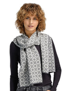 Dale of Norway Christiania Scarf in Offwhite Metalgrey featuring the classic Norwegian-inspired Christiania knit pattern.