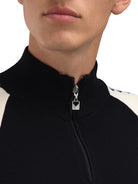 Dale of Norway Men's Geilo Sweater in Black Offwhite, a sporty Norwegian quarter-zip sweater made from 100% skin-soft merino wool.