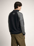 Dale of Norway Men's Geilo Sweater in Darkcharcoal Smoke, a sporty Norwegian quarter-zip sweater made from 100% skin-soft merino wool.