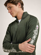Dale of Norway Men's Geilo Sweater in Darkgreen Offwhite, a sporty Norwegian quarter-zip sweater made from 100% skin-soft merino wool.
