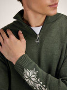 Dale of Norway Men's Geilo Sweater in Darkgreen Offwhite, a sporty Norwegian quarter-zip sweater made from 100% skin-soft merino wool.