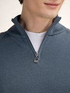 Dale of Norway Men's Geilo Sweater in Steel Offwhite, a sporty Norwegian quarter-zip sweater made from 100% skin-soft merino wool.