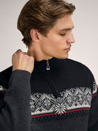 Dale of Norway Men's Moritz Sweater in Darkcharcoal Raspberry Black, a classic Norwegian ski sweater made from 100% merino wool.