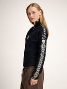 Dale of Norway Women's Geilo Sweater in Black Offwhite, a slim-fit quarter-zip sweater made from 100% skin-soft merino wool.