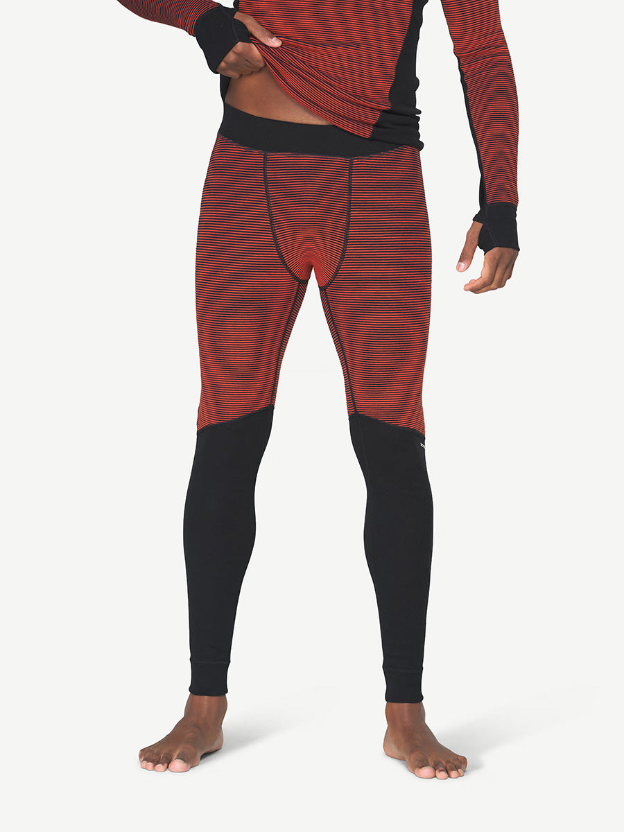 Devold Men's Reverso Merino Longs in Brick, reversible merino wool baselayer with breathable flat-knit and insulating 3D-knit sides.