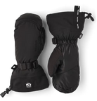 A pair of black Hestra Army Leather Extreme Mittens, which are designed to keep your hands warm and dry in harsh winter conditions.