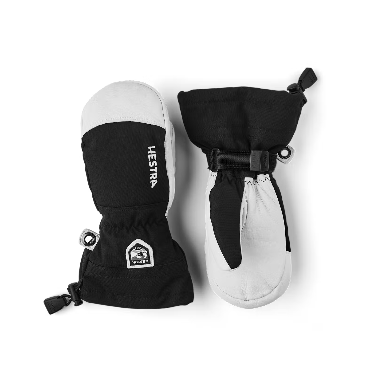 A pair of black and white Hestra Junior Army Leather Heli Ski Mittens made from premium leather.