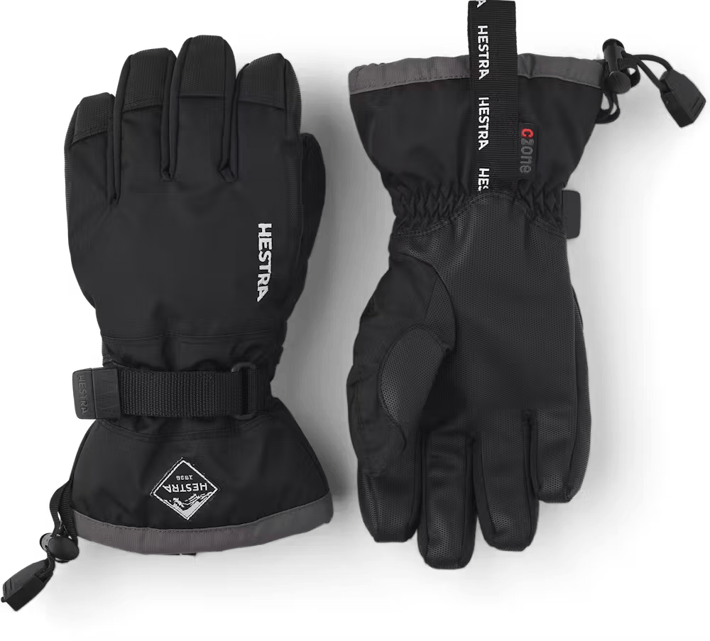A pair of black Hestra Jr Gauntlet CZone Gloves that are designed to keep your child's hands warm and dry in harsh winter conditions.