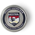 A container of Hestra Leather Balm, which is designed to keep leather gloves and mittens in pristine condition.