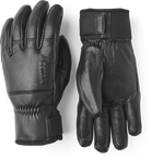A pair of black leather Hestra Omni Gloves that are designed to keep your hands warm and dry in harsh winter conditions.