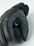 A pair of black Hestra Omni Trigger Gloves that are made from premium leather and feature a trigger loop for Leki Ski Poles.