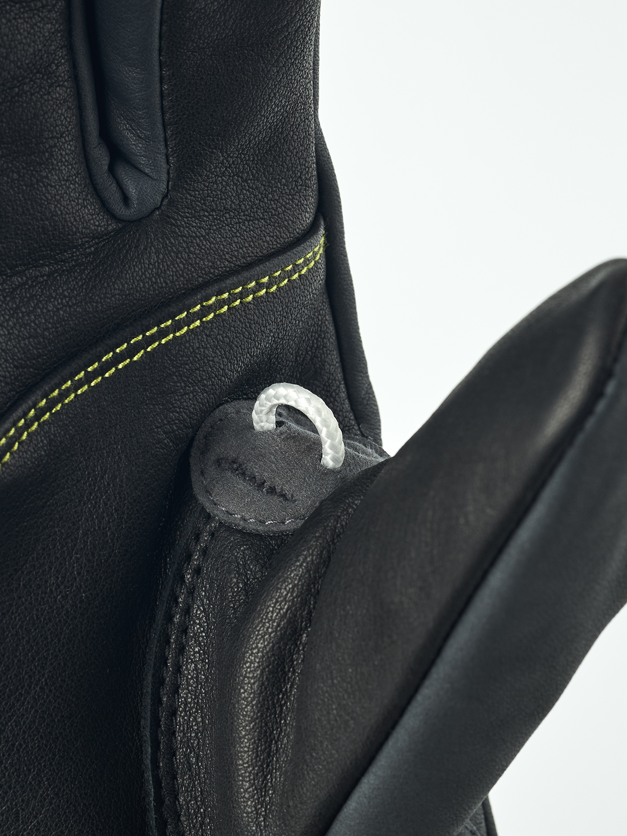 A close-up of a black Hestra Omni Trigger Glove that are made from premium leather and feature a trigger loop for Leki Ski Poles.