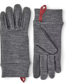 A pair of grey Hestra Touch Point Warmth Glove Liners, which are designed to keep your hands extra warm in freezing conditions.