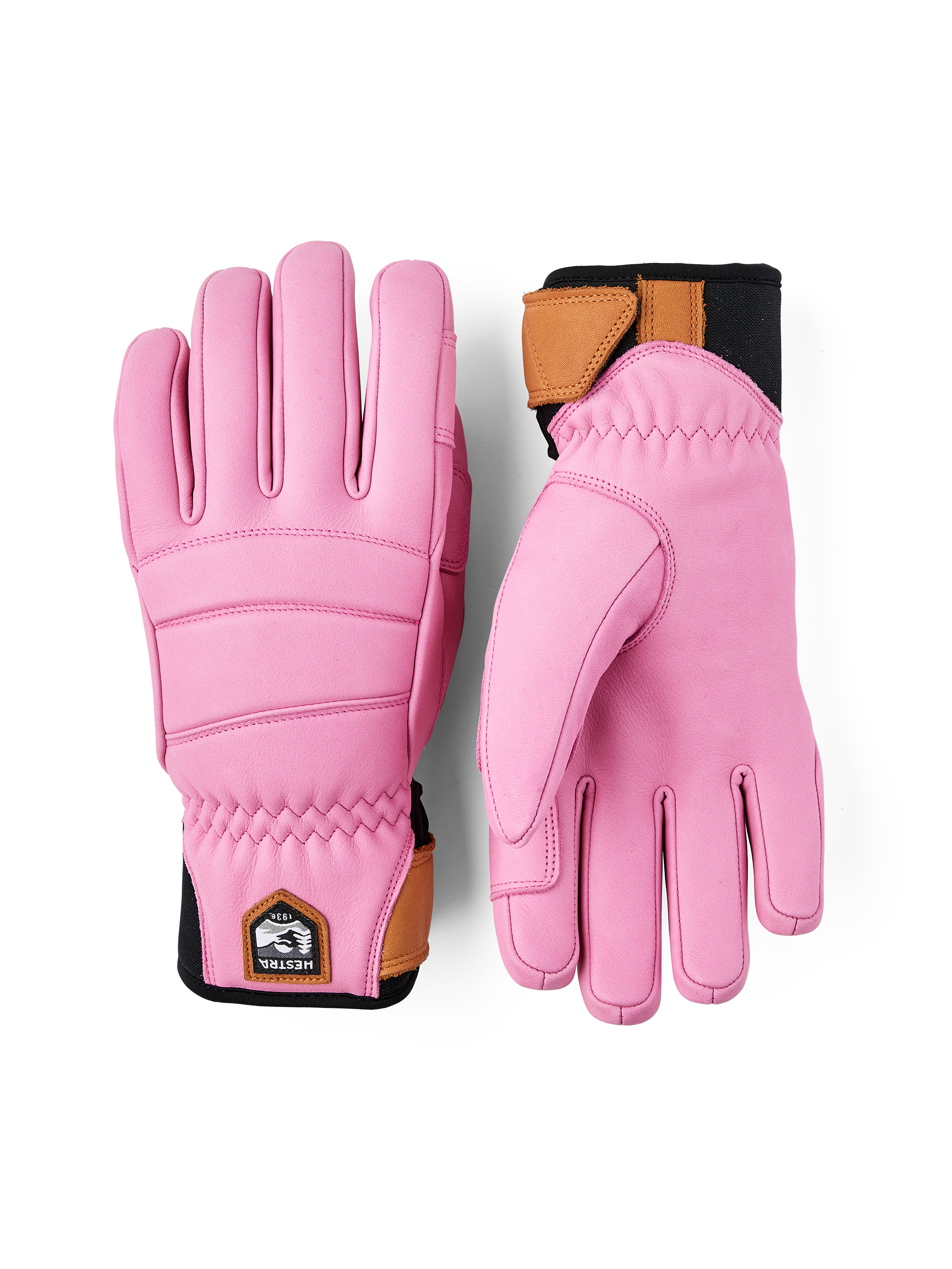 A pair of pink Hestra Women's Fall Line Gloves that are made from premium leather.