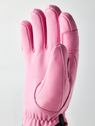 A pink Hestra Women's Fall Line Glove that is made from premium leather.
