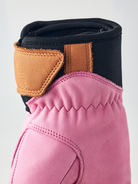 A pink Hestra Women's Fall Line Glove that is made from premium leather.