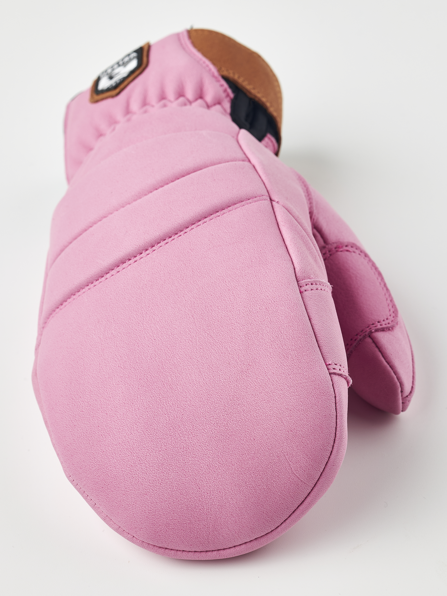A pair of pink Hestra Women's Fall Line premium leather mittens.