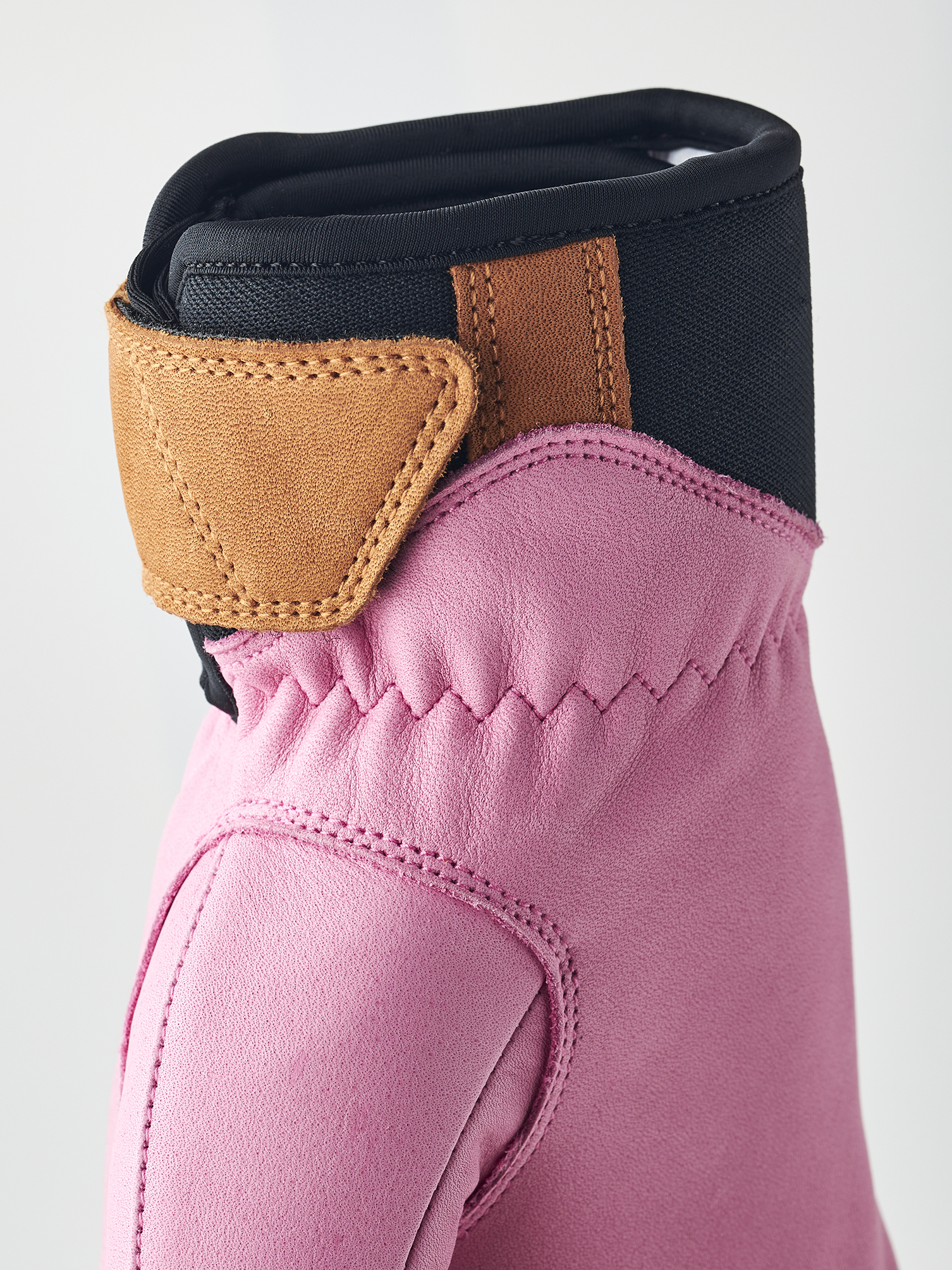 A pair of pink Hestra Women's Fall Line premium leather mittens.