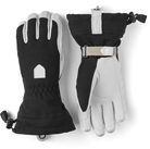  A pair of black and white Hestra Women’s Patrol Gauntlet Gloves, which are designed to keep your hands warm and dry in harsh winter conditions.