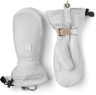 A pair of white Hestra Women’s Patrol Gauntlet Mittens, which are designed to keep your hands war and dry in harsh winter conditions.