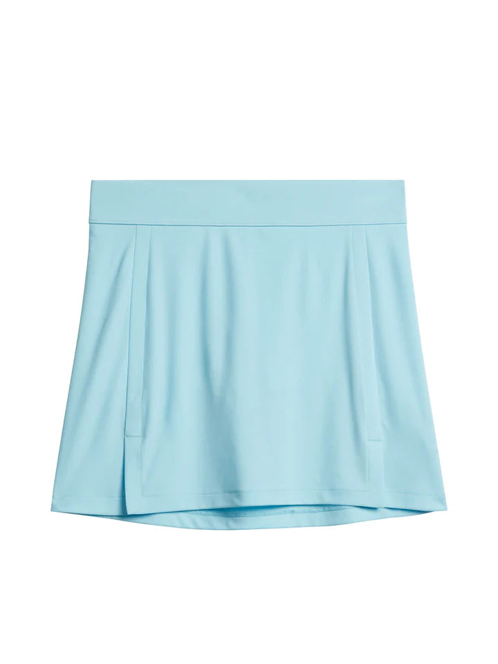 J.Lindeberg Women's Amelie Mid golf skirt with built-in shorts and breathable stretch performance fabric for golf and resort wear