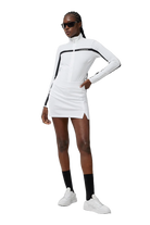 J.Lindeberg Women's Amelie Mid golf skirt with built-in shorts and breathable stretch performance fabric for golf and resort wear