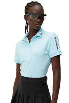 J.Lindeberg Women's Tour Tech golf polo with breathable four-way stretch performance fabric and athletic fit for golf wear