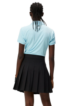 J.Lindeberg Women's Tour Tech golf polo with breathable four-way stretch performance fabric and athletic fit for golf wear