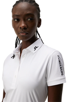 J.Lindeberg Women's Tour Tech golf polo with breathable four-way stretch performance fabric and athletic fit for golf and active wear