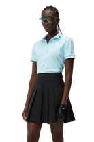 J.Lindeberg Women's Tour Tech golf polo with breathable four-way stretch performance fabric and athletic fit for golf wear