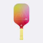 A Joola pickleball paddle with a vibrant yellow-to-pink gradient face and a yellow wrapped handle.