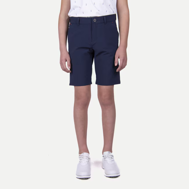 KJUS Boys' Iguana Golf Shorts featuring lightweight stretch fabric, breathable comfort, practical pockets, and a junior performance fit for golf.