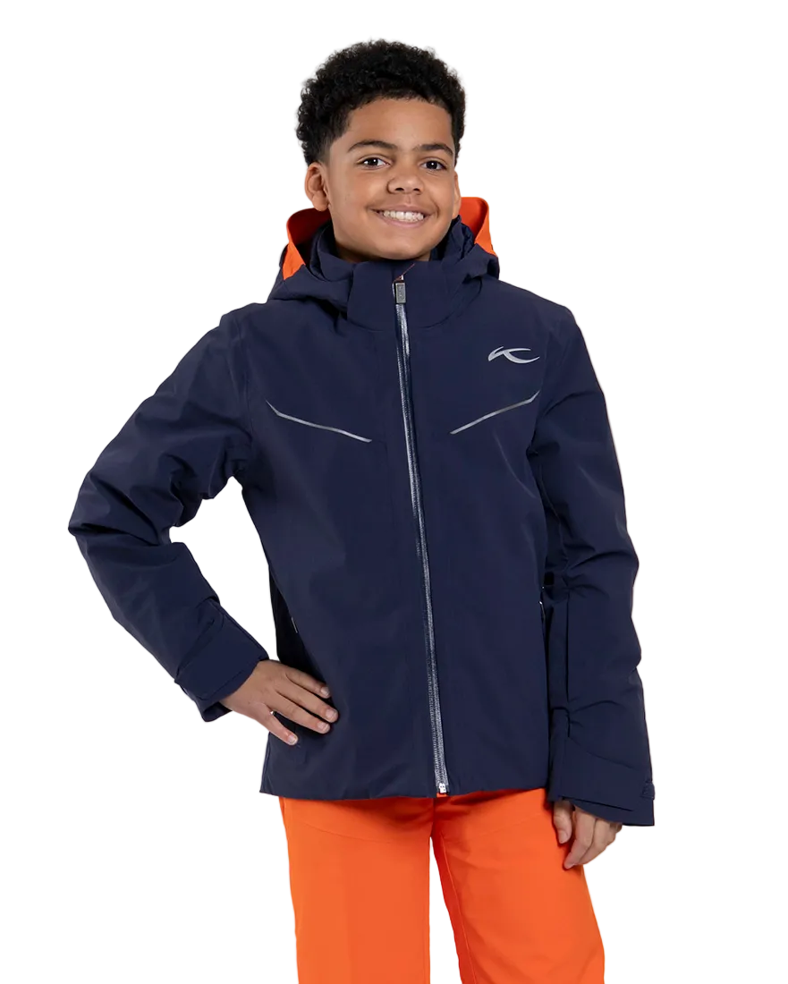 Front view of a blue Kjus Jr Boys’ Formula Jacket featuring 4-way stretch waterproof fabric, Fast Thermo Core insulation, water-repellent zippers, and the KJUS-GROW sleeve extension system.