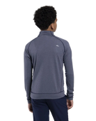 Rear view of the Kjus Jr Boys’ Keano Half-Zip featuring soft brushed-back fabric, a half-zip stand-up collar, multi-directional stretch, and flatlock seam construction.