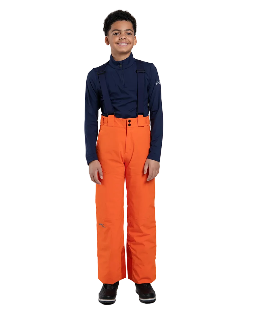 Front view of orange Kjus Jr Boys’ Vector Max Pants featuring 2-layer waterproof fabric, Fast Thermo Core insulation, water-repellent zippers, reinforced scuff guards, and the KJUS-GROW leg extension system.