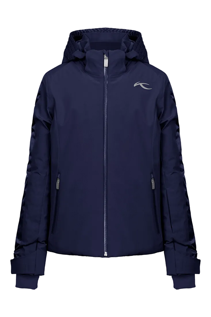 Front view of an Atlanta blue Kjus Jr Girls’ Snowfall Jacket featuring 4-way stretch waterproof fabric, Fast Thermo Core insulation, water-repellent zippers, and the KJUS-GROW sleeve extension system.