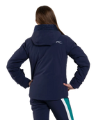 Rear view of an Atlanta blue Kjus Jr Girls’ Snowfall Jacket featuring 4-way stretch waterproof fabric, Fast Thermo Core insulation, water-repellent zippers, and the KJUS-GROW sleeve extension system.
