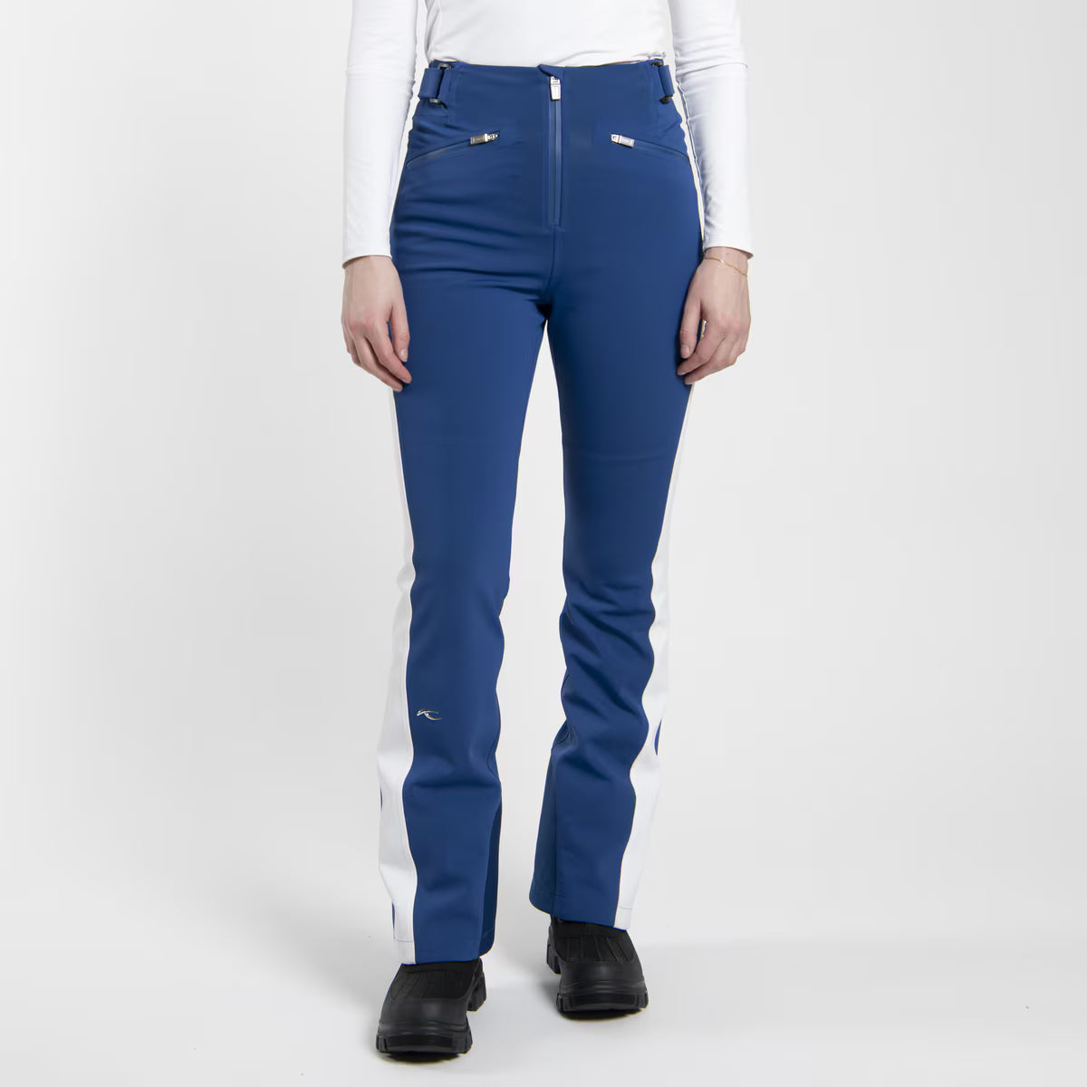 KJUS Women's Core Embrace Ski Pants featuring waterproof construction, lightweight insulation, four-way stretch fabric, articulated knees, and a women's-specific fit.