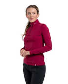 Front view of a Kjus Women’s Feel Midlayer Half-Zip Sweater featuring soft brushed-back fabric, a half-zip stand-up collar, multi-directional stretch, and flatlock seam construction.