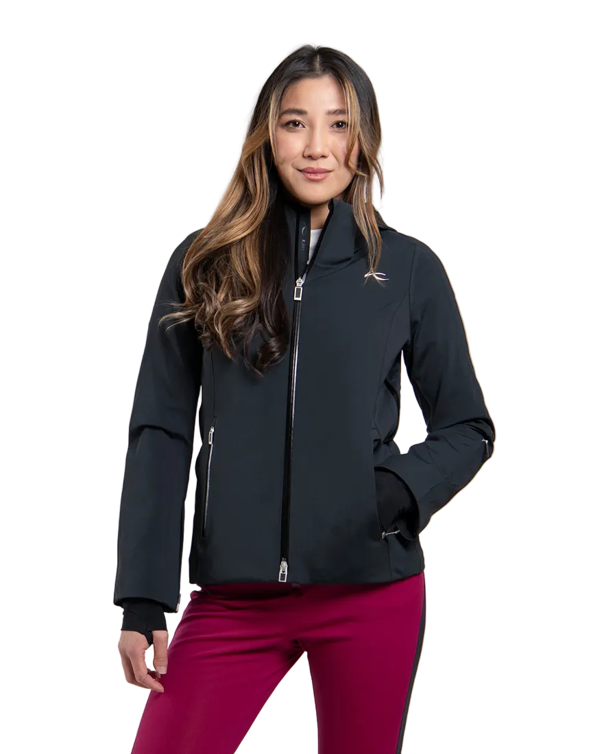 Front view of a black Kjus Women’s Formula Jacket featuring 4-way stretch waterproof fabric, Fast Thermo Core insulation, water-repellent zippers, AC-Vent forearm ports, and a detachable helmet-compatible hood.