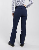 Front view of black Kjus Women’s Formula Pants featuring 4-way stretch waterproof fabric, Fast Thermo Core insulation, water-repellent zippers, and Schoeller Keprotec reinforced scuff guards.