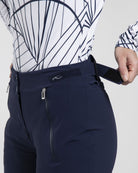 Front view of black Kjus Women’s Formula Pants featuring 4-way stretch waterproof fabric, Fast Thermo Core insulation, water-repellent zippers, and Schoeller Keprotec reinforced scuff guards.