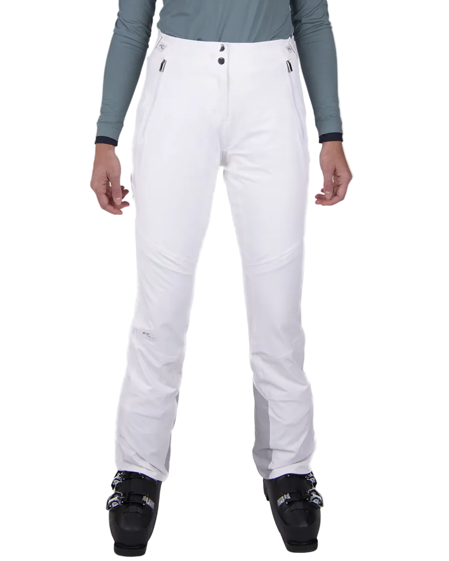 Front view of white Kjus Women’s Formula Pants featuring 4-way stretch waterproof fabric, Fast Thermo Core insulation, water-repellent zippers, and Schoeller Keprotec reinforced scuff guards.