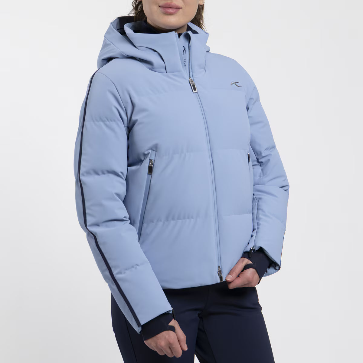 KJUS Women's Twilight Ski Jacket featuring waterproof construction, lightweight insulation, four-way stretch fabric, adjustable hood, and premium alpine performance.