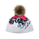 A photo of the Krimson Klover Gondola Beanie featuring a fine-gauge knit, interior fleece earband lining, folded cuff, custom alpine graphic knit design, and a faux-fur pom topper.