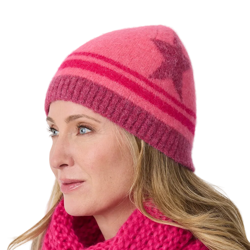 Front-view photo of an azalea Krimson Klover Lumi Beanie featuring a fine-gauge technical knit, interior fleece earband lining, folded cuff, and faux-fur pom topper.