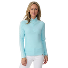A woman wearing a light blue Krimson Klover Women's Slalom Zip Neck Sweater with white snowflake jacquard sleeve details and a quarter zip front.